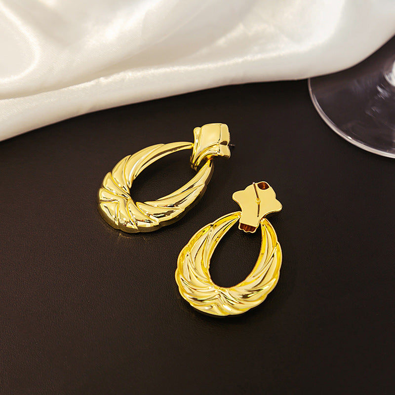 Boucles d'oreilles creuses en forme de U à texture plaquée or pour femmes