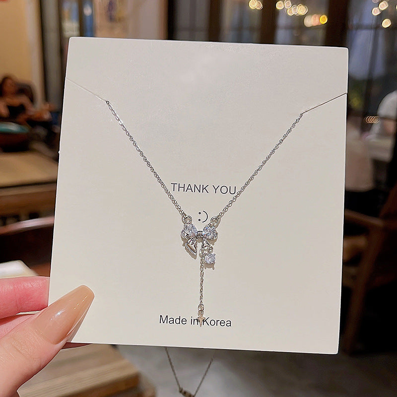 Schlüsselbeinhalsketten aus raffiniertem Zirkon mit langer Quaste und Schleife