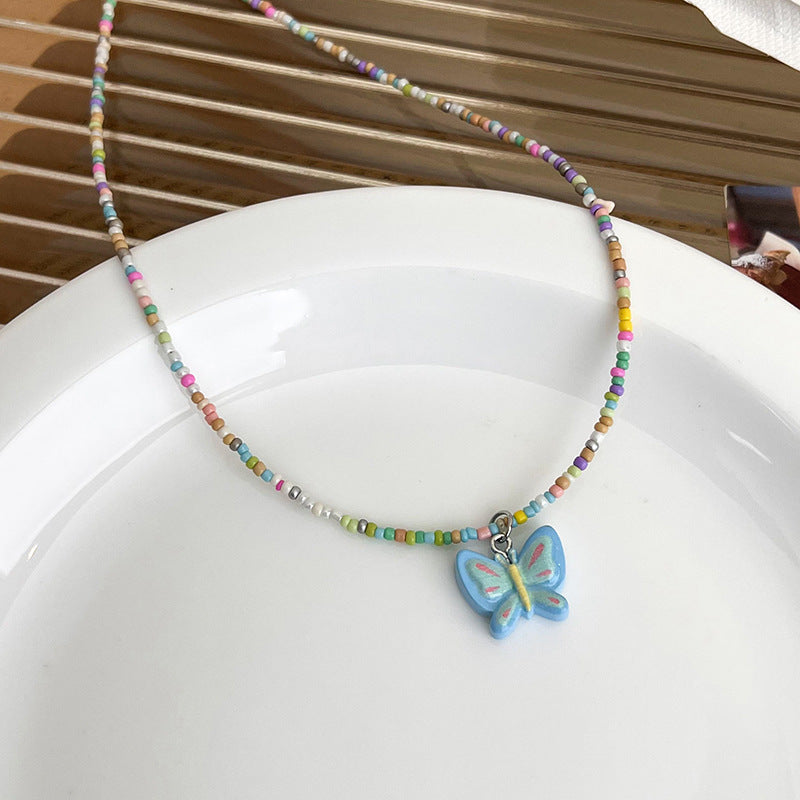 Pendentif papillon pour femmes, colliers d'été doux et frais de couleur Dopamine