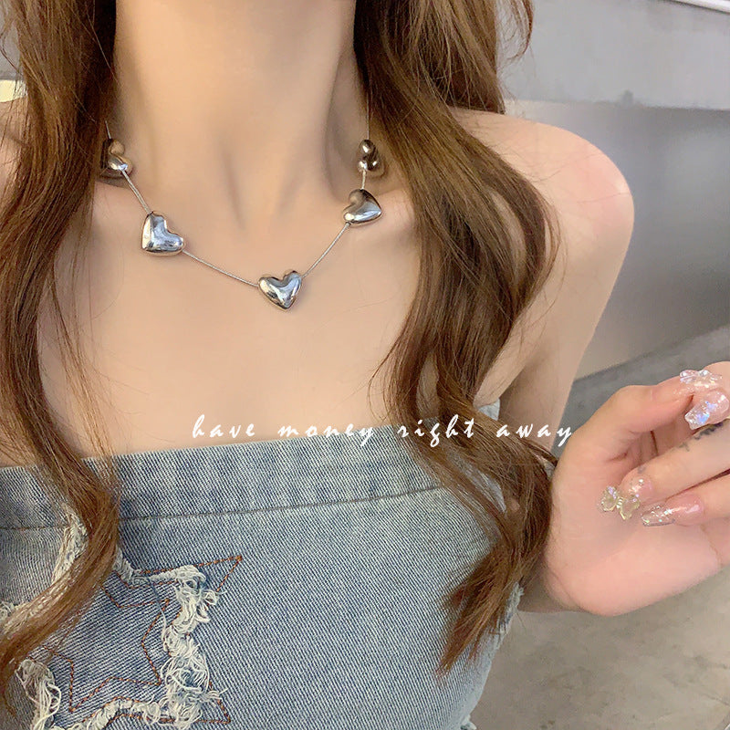 Colliers de clavicule en forme de coeur de tempérament féminin d'amour de Style froid