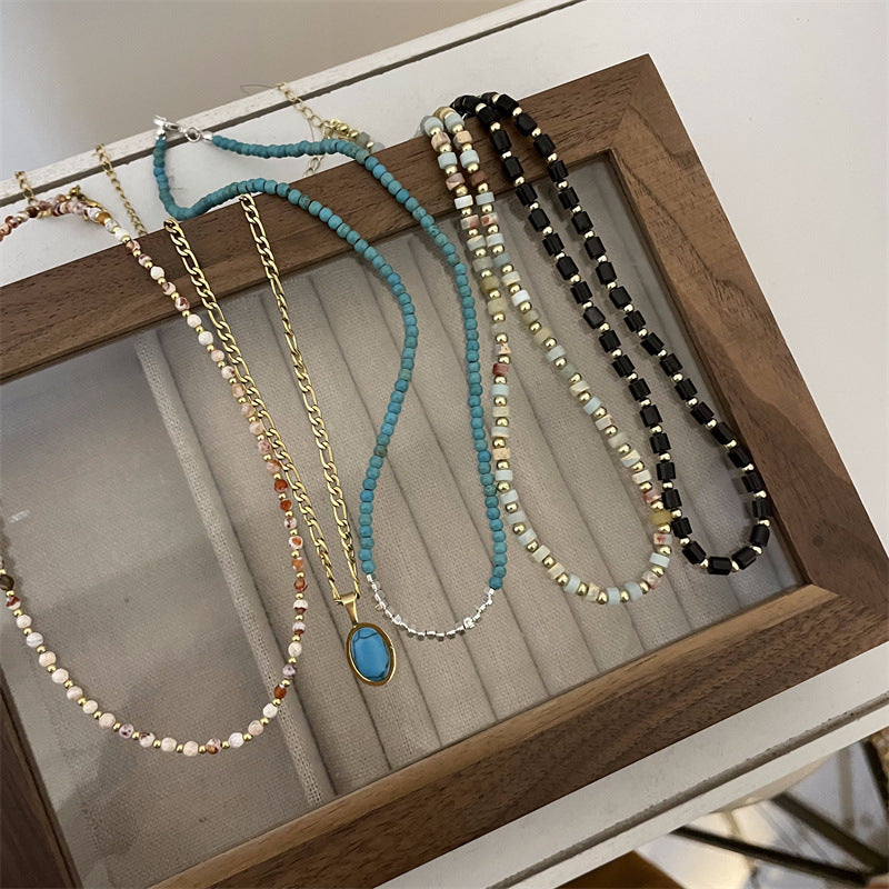 Femmes et hommes perles pour la lumière luxe minorité tempérament de haute qualité colliers en titane