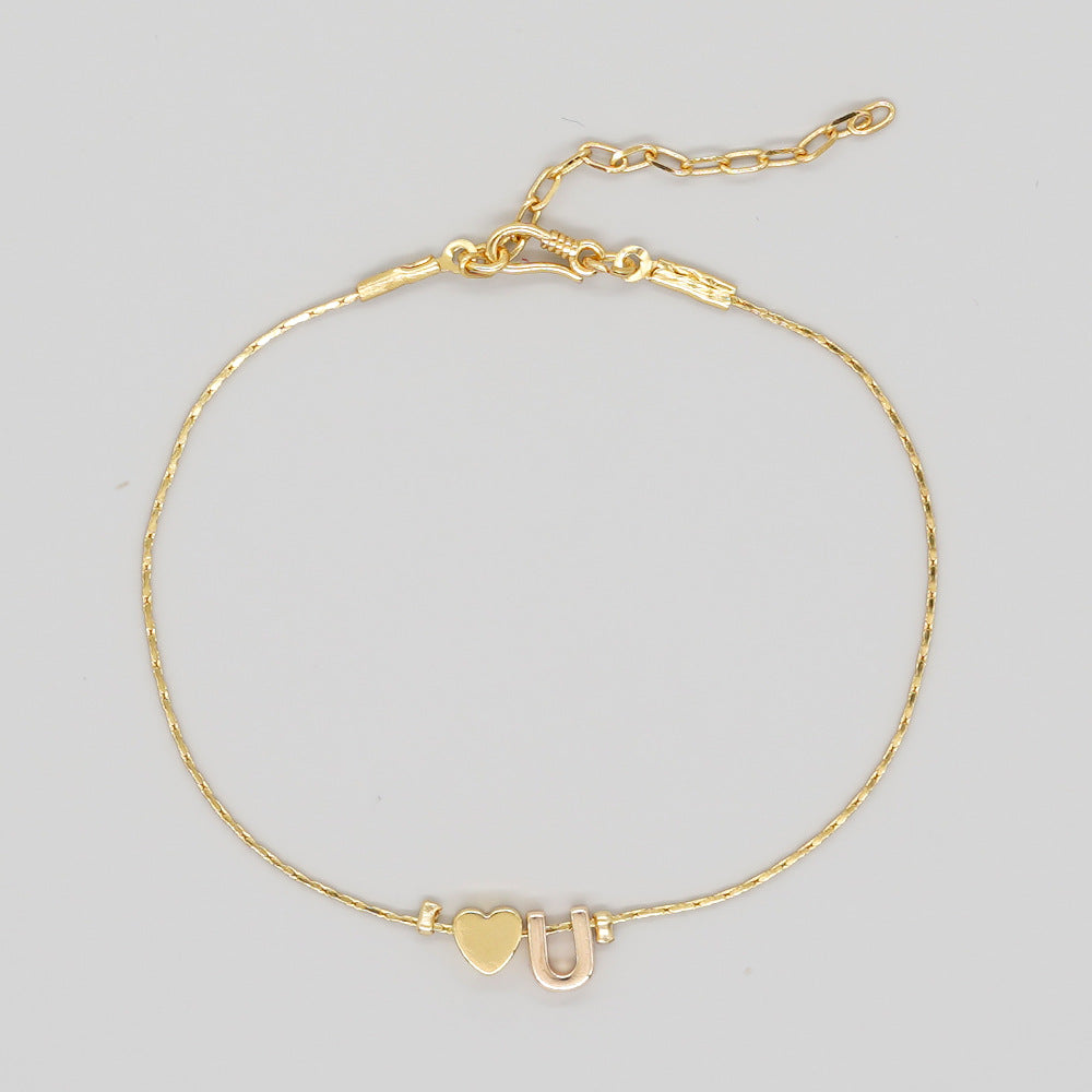Damenkette mit vergoldetem Pfirsichherz und herzförmigen Buchstabenarmbändern