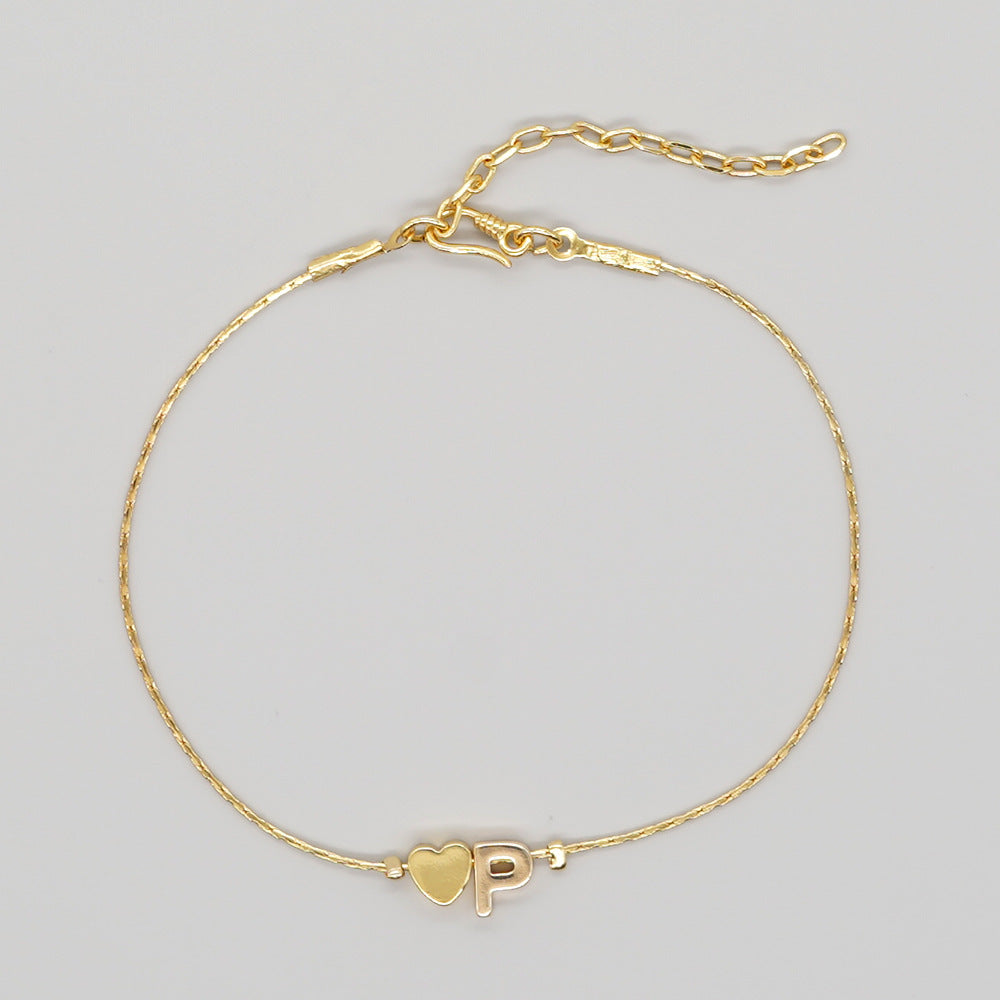 Damenkette mit vergoldetem Pfirsichherz und herzförmigen Buchstabenarmbändern