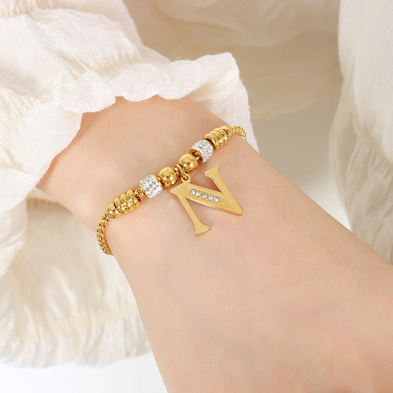 Goldene englische Buchstaben-Anhänger mit Strass-Quasten-Armbändern