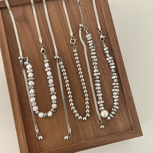 Colliers de niche en chaîne d'os de serpent en acier titane Of Sier