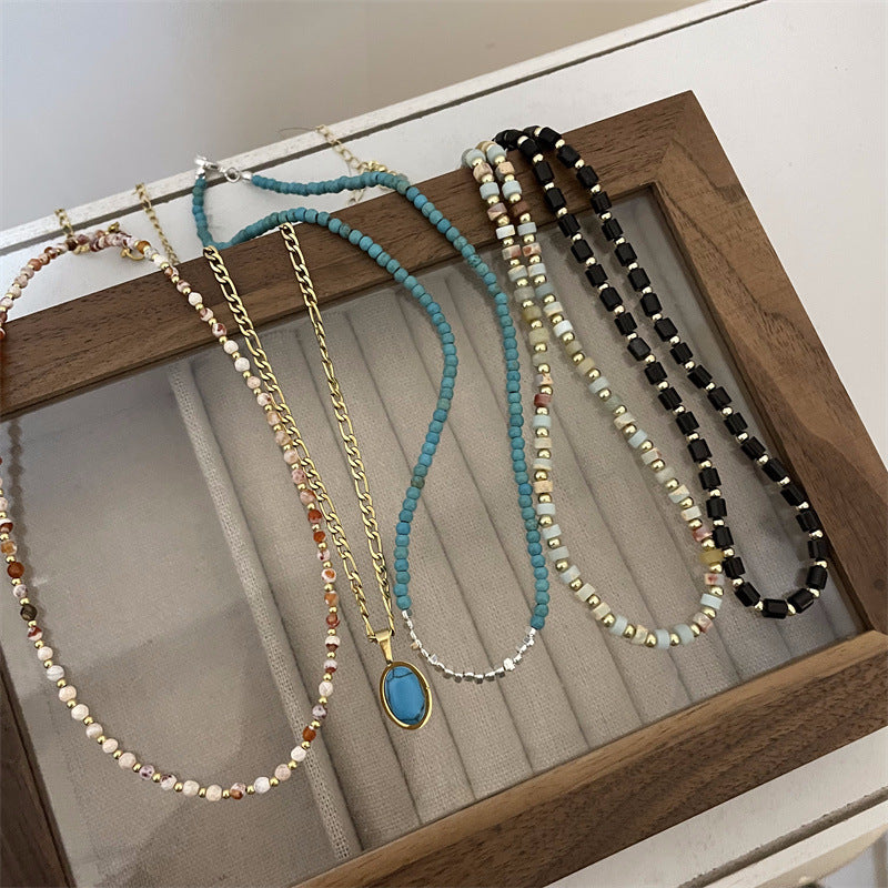 Femmes et hommes perles pour la lumière luxe minorité tempérament de haute qualité colliers en titane