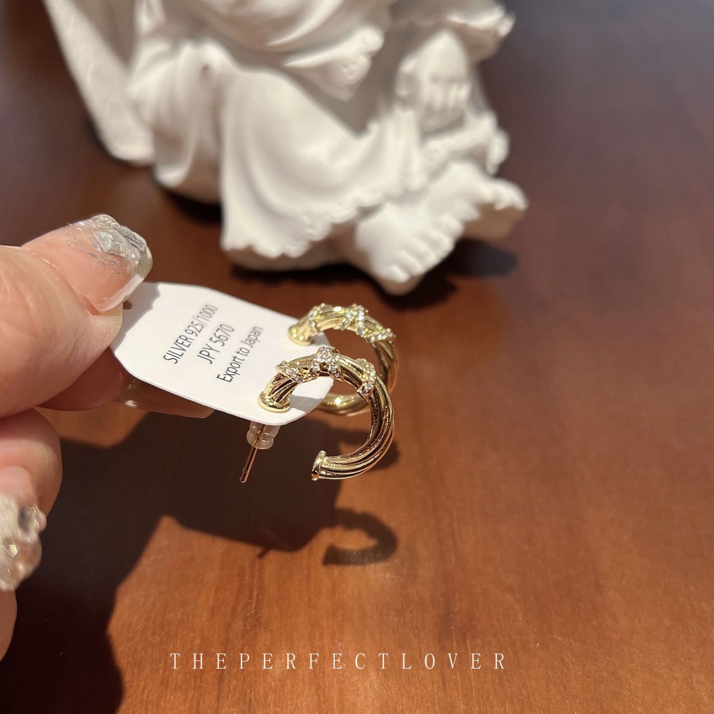 Winding Light Luxury High-grade Female Niche Earrings