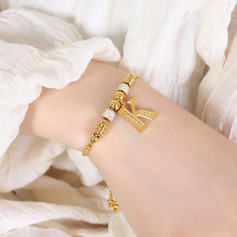 Goldene englische Buchstaben-Anhänger mit Strass-Quasten-Armbändern