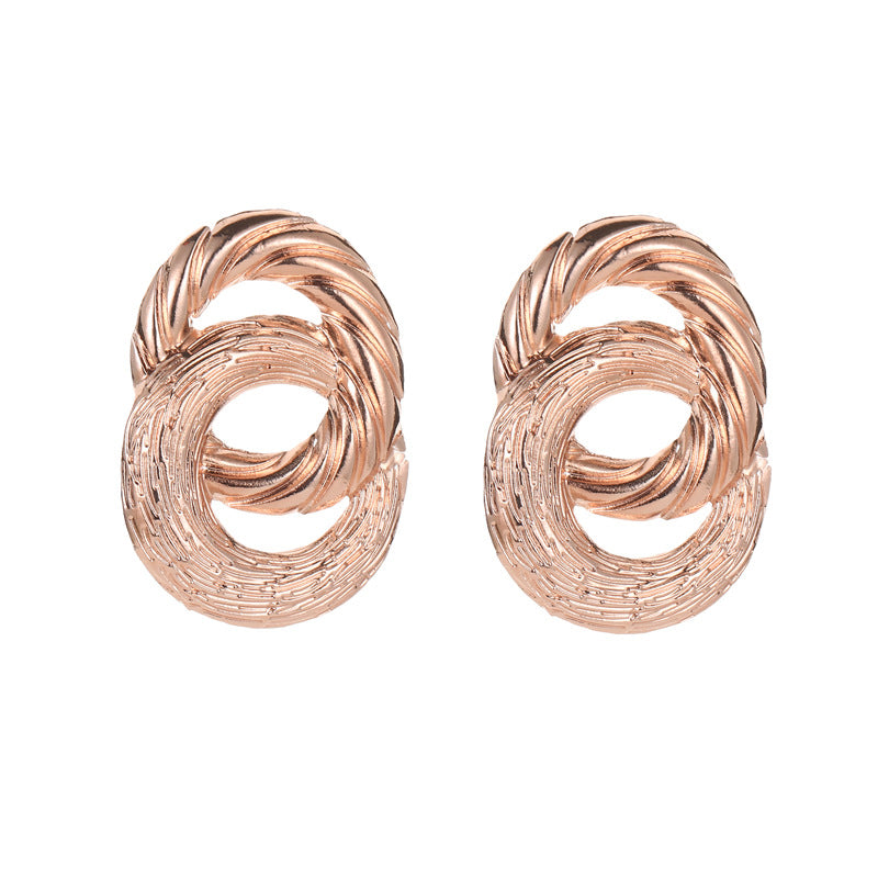 Boucles d'oreilles à distribution féminine à grain géométrique torsadé en cercle