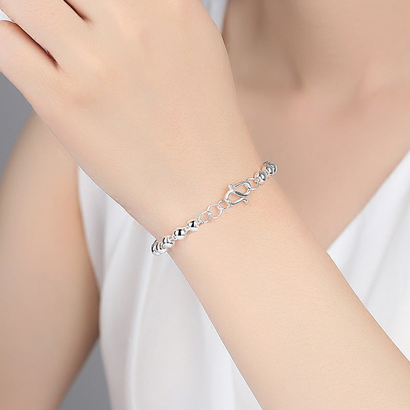 Bracelets femme petites perles rotatives en argent sterling