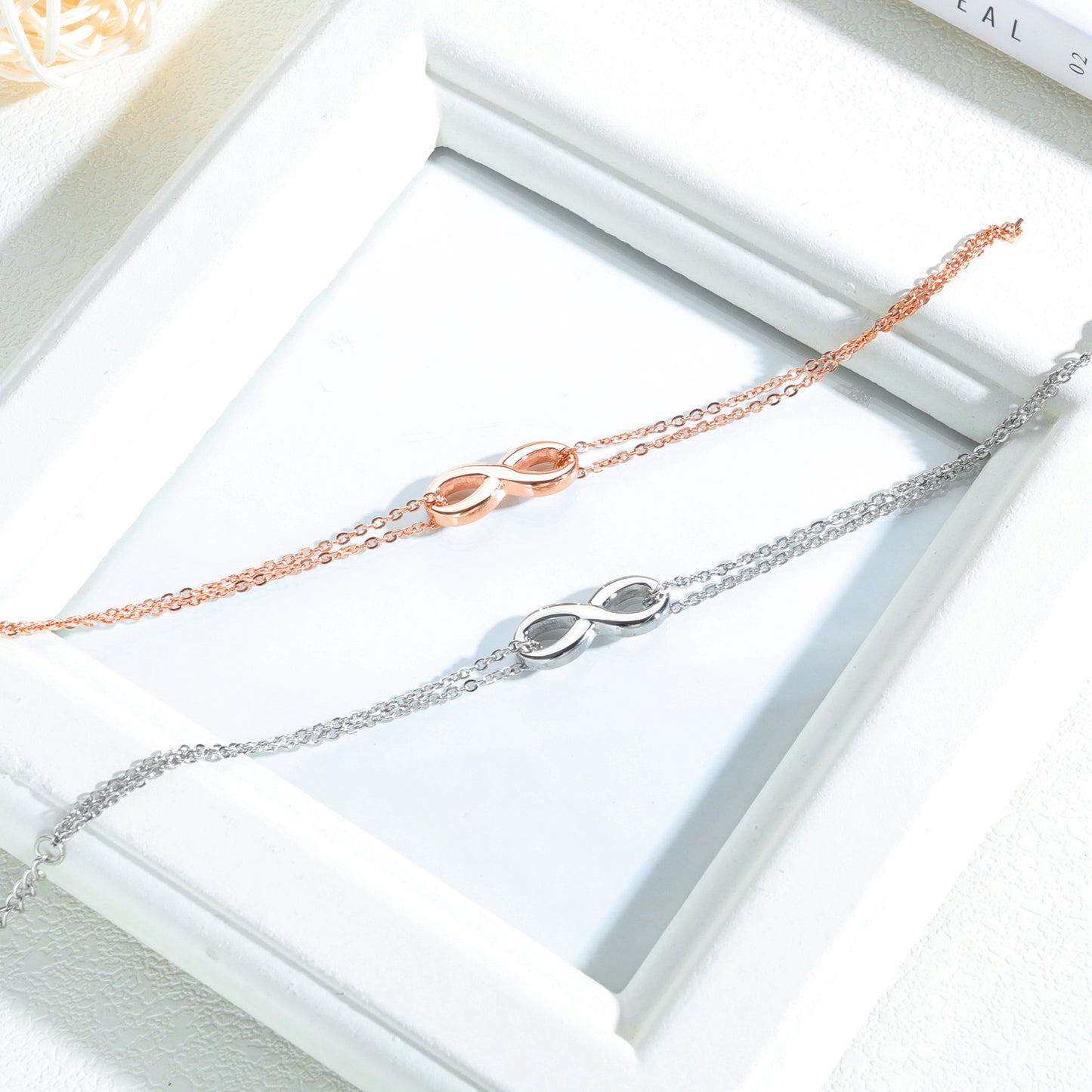 Infinite-Armbänder für Damen mit Titanstahlbeschichtung und Roségold