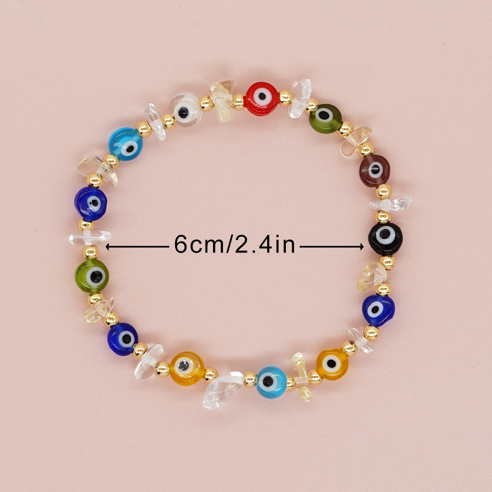 Bracelets boulier style boules dorées yeux en verre