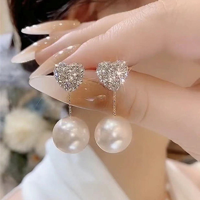 Bijoux coeur aimant un style pour boucles d'oreilles avancées élégantes en perles