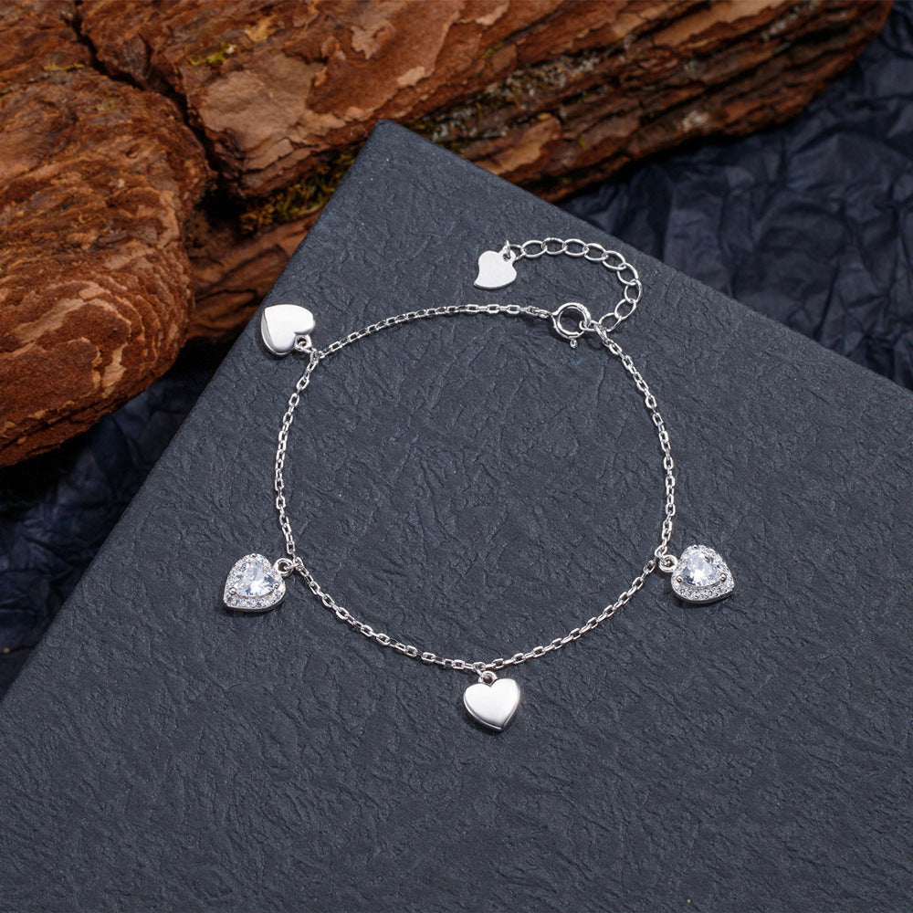 Bracelets de conception de niche féminine en argent sterling avec cœur aimant simple