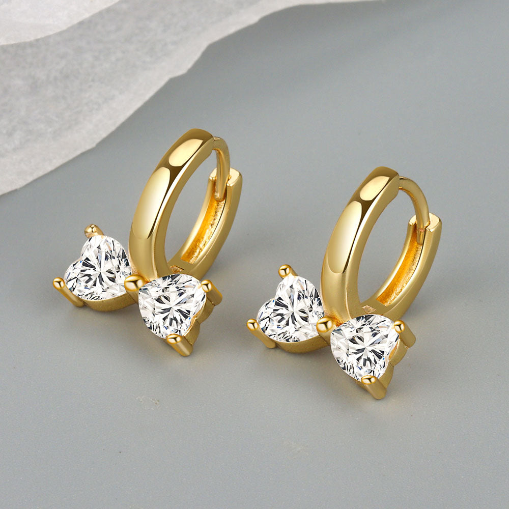 Petites boucles d'oreilles de niche en zircon incrusté de cuivre et nœud