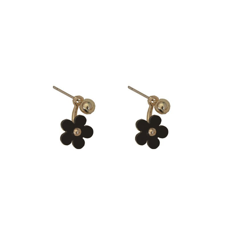 Boucles d'oreilles noires à petite fleur et mini marguerite sur le devant