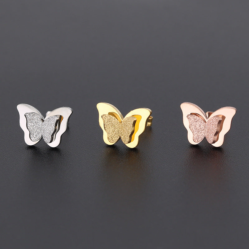 Boucles d'oreilles en titane double papillon givré pressées au sable pour femmes