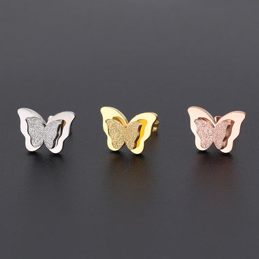 Boucles d'oreilles en titane double papillon givré pressées au sable pour femmes