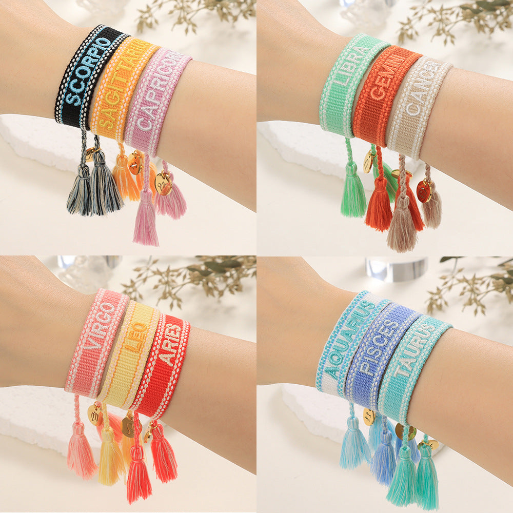 Bracelets à dragonne tissés avec lettres brodées Twee Constellations