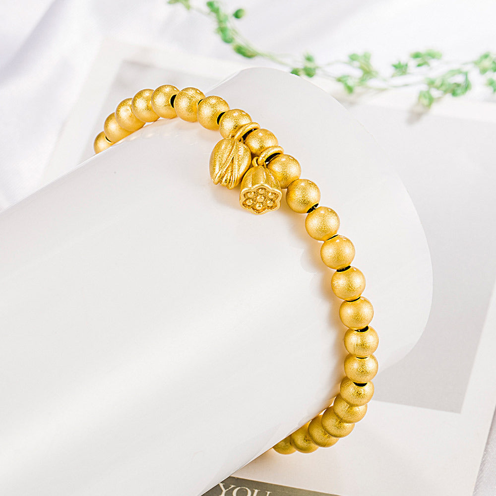 National Fashion für Damen, zwei altgoldene Lotus-Samenkapsel-Armbänder