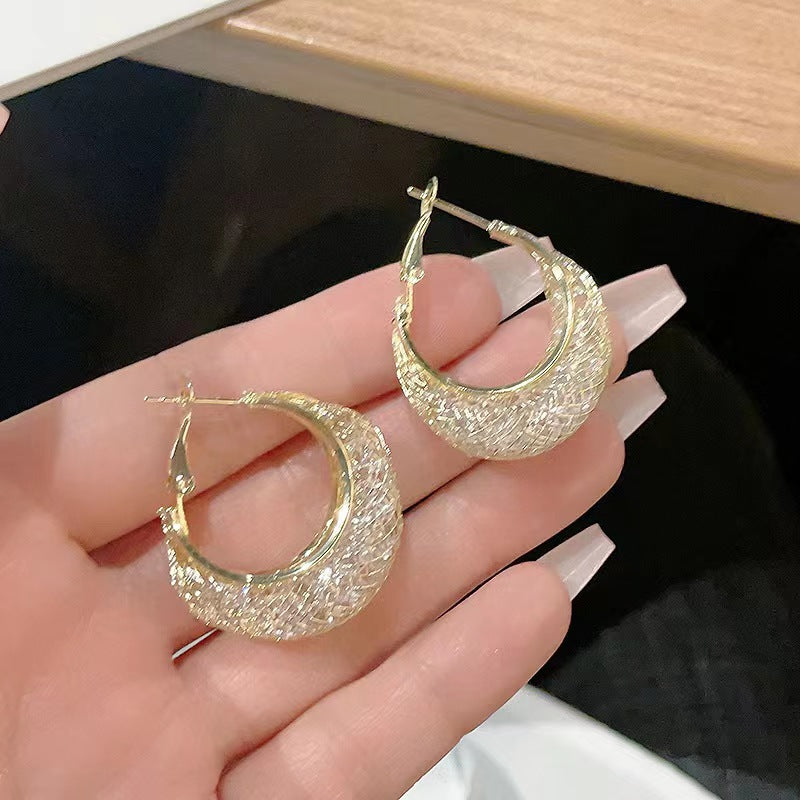 Boucles d'oreilles de niche exquises en métal de luxe léger et élégant pour femmes