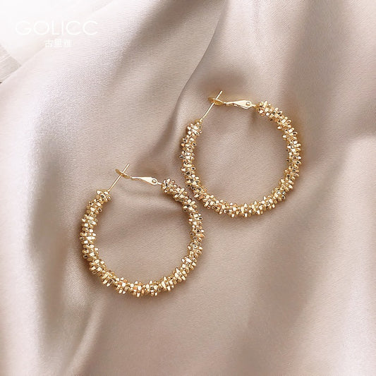 Boucles d'oreilles hautes de personnalité gracieuse de style féminin de cercle