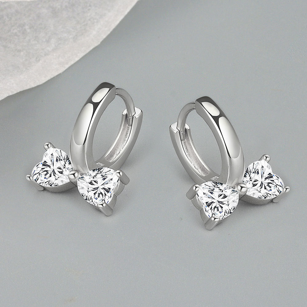 Petites boucles d'oreilles de niche en zircon incrusté de cuivre et nœud