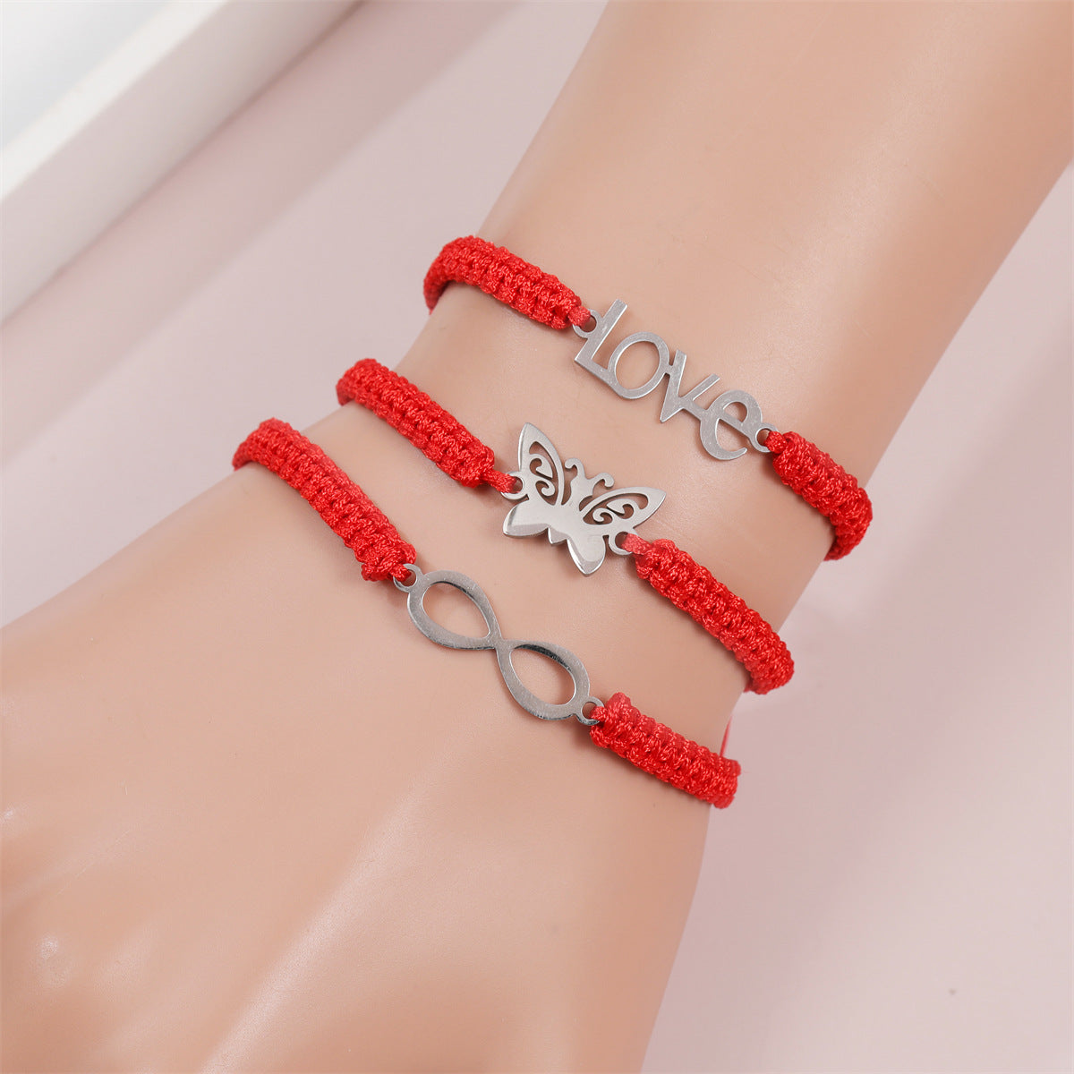 Bracelets simples en acier inoxydable avec corde rouge et papillon