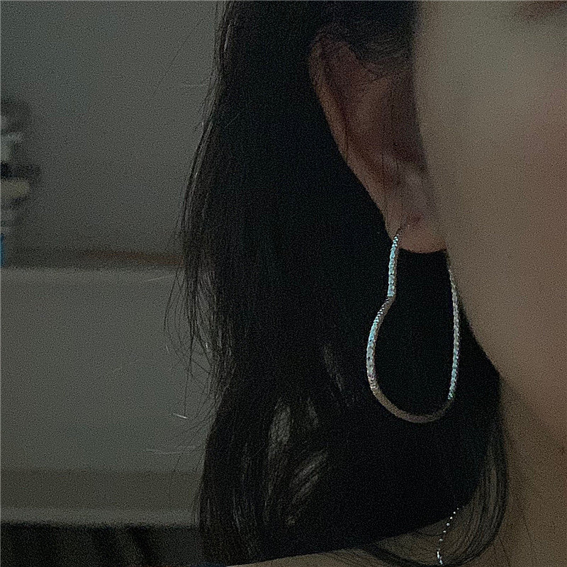 Carven Design - Grandes boucles d'oreilles en forme de cœur ondulé brillant