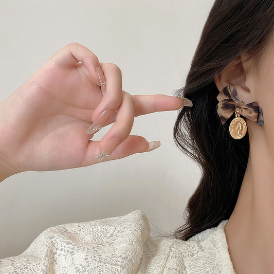 Boucles d'oreilles de tempérament féminin avec nœud léopard et pièce d'or