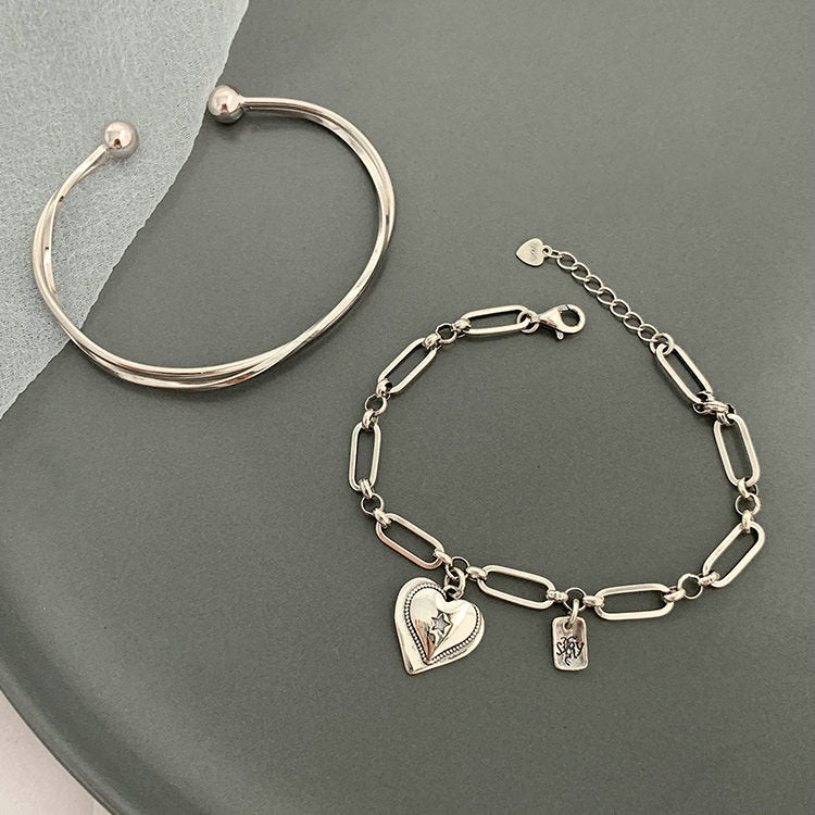 Bracelets de simplicité de personnalité polyvalente de coeur rétro de mode des femmes