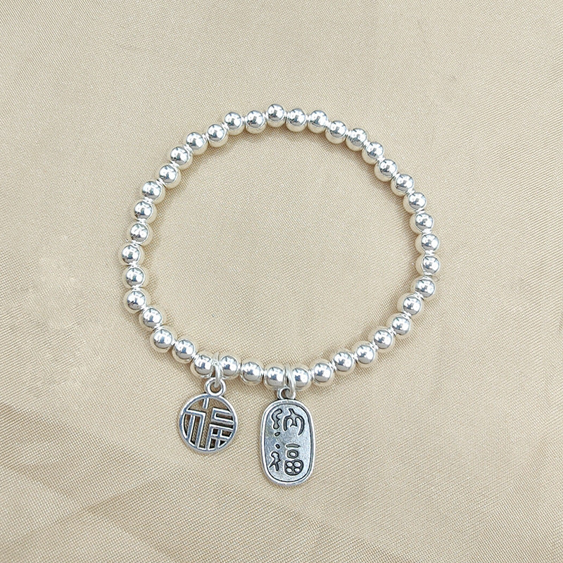 Deux bracelets en argent imitation graine de lotus